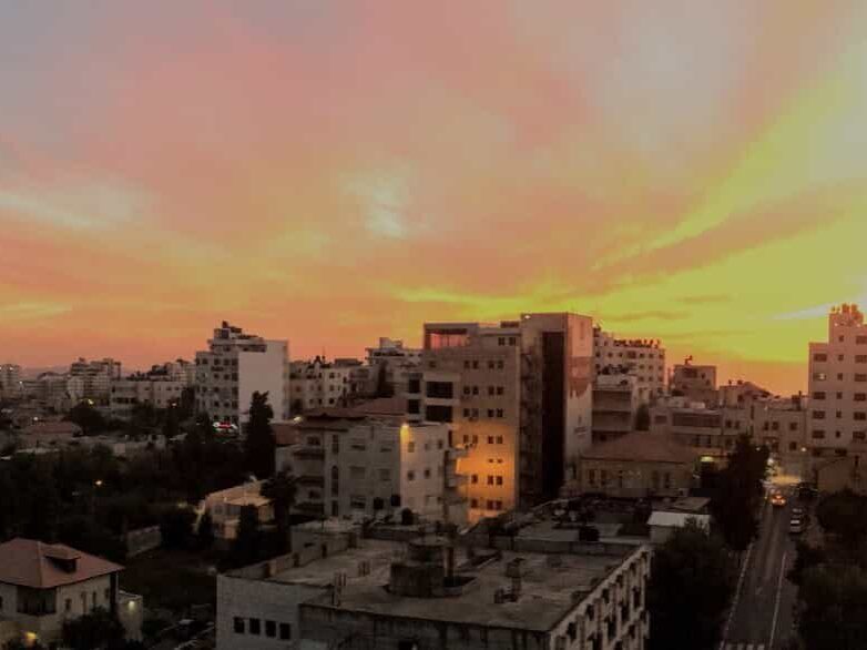 Panoramic view of sunset over the old city and the southern and western neighborhoods of Ramallah -2016, credit: Fjmustak